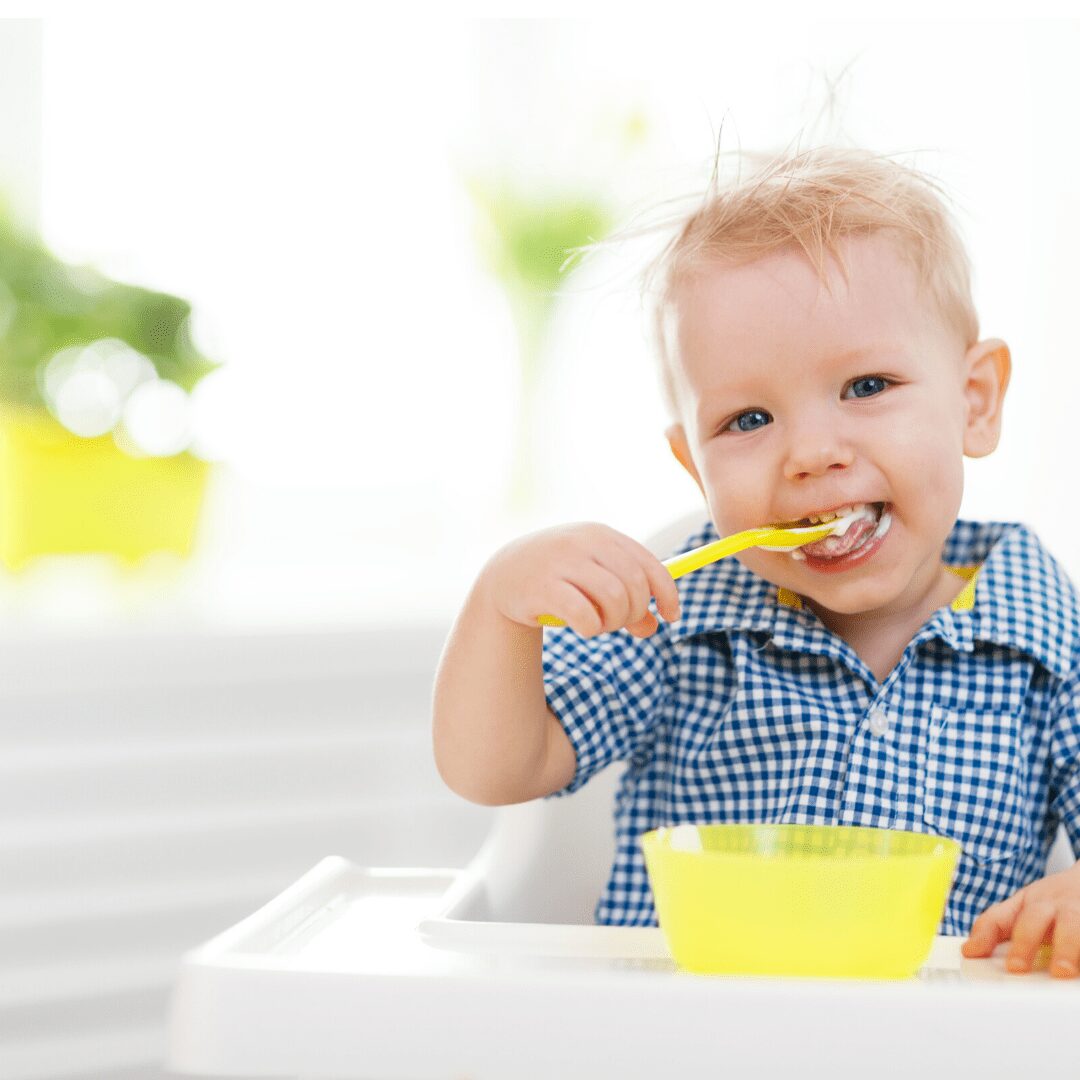 Toddler Eating Out Of Yellow Bowl