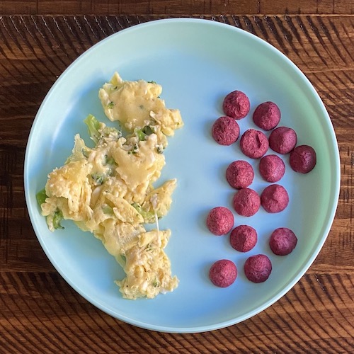 Toddler breakfast broccoli eggs and cheese.