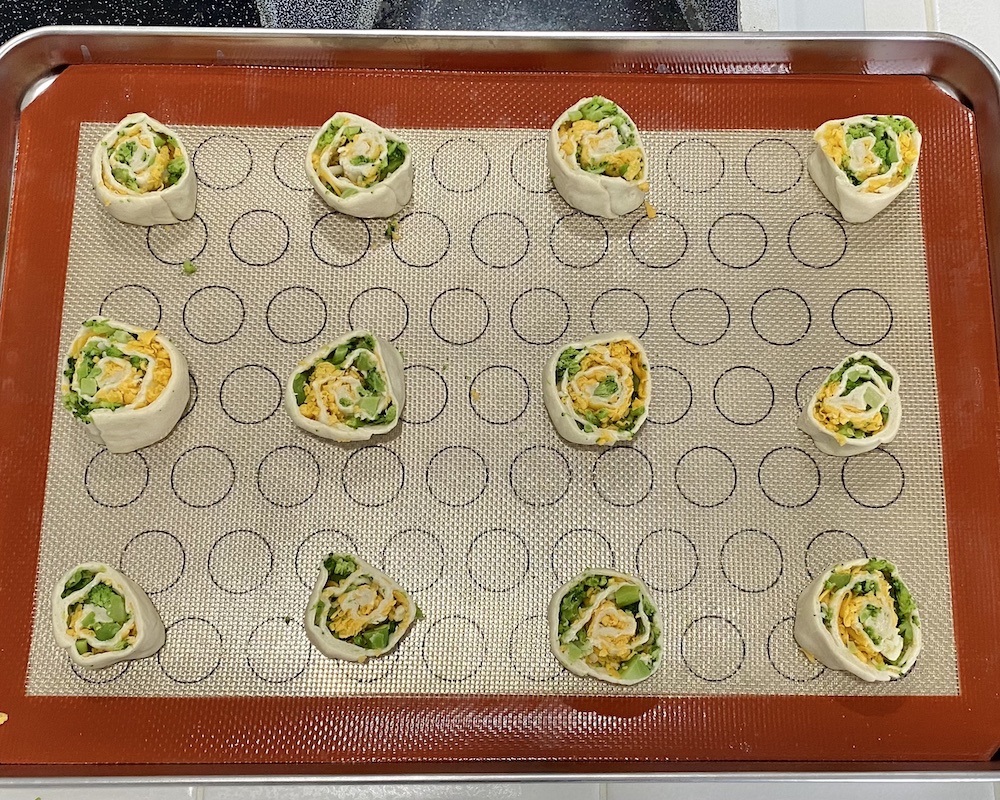 Broccoli & cheese pinwheels: rolled up pinwheels before cooking