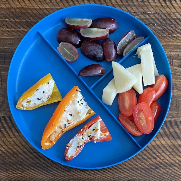 Toddler lunch plate showing cream cheese stuffed peppers